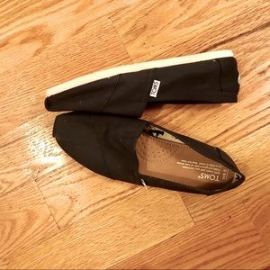 Tom’s slip on shoes never worn.